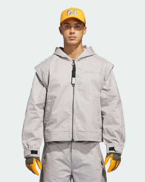 Black full-zip hoodie from Adidas x Bad Bunny x Mercedes featuring balaclava-style hood and signature racing stripe accents