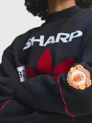 Adidas Manchester United Legendary 91/92 Crewneck Fleece Sweatshirt with timeless design, ribbed trims, and vintage football style