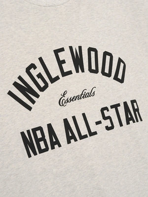 Recreated vintage-style grey graphic T-shirt from Essentials Inglewood x All Star Weekend ’26 with bold artwork