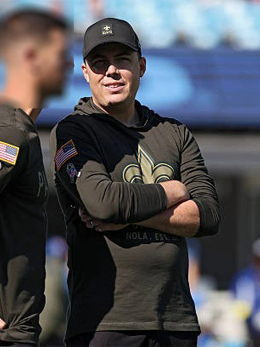 2025 New Orleans Saints Salute to Service forest green hooded T-shirt designed for coach-inspired sideline wear.