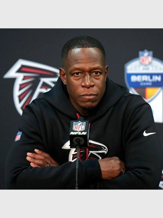 Atlanta Falcons 2025 black pullover hoodie worn by Coach Raheem Morris on the sidelines.