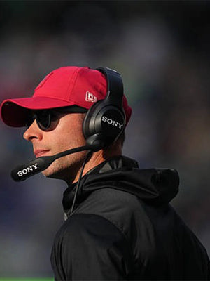Coach Jonathan Gannon Arizona Cardinals black half-zip hooded jacket for the 2025 Cardinals vs Seahawks game.