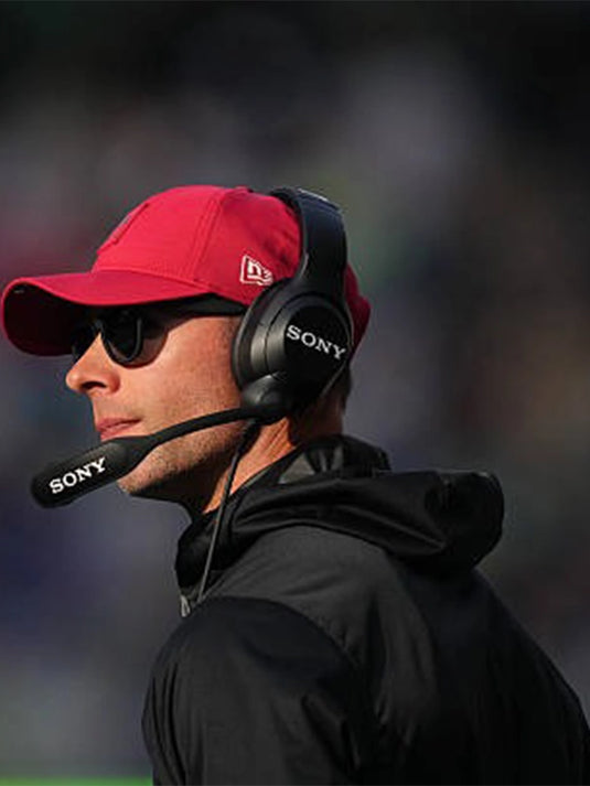 Coach Jonathan Gannon Arizona Cardinals black half-zip hooded jacket for the 2025 Cardinals vs Seahawks game.