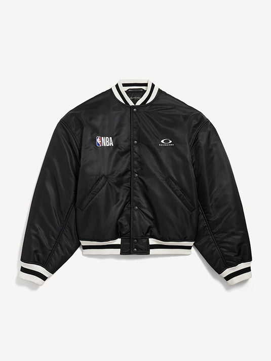 Black satin bomber jacket from Balenciaga x NBA 2026 featuring a coach-inspired silhouette and luxury streetwear energy