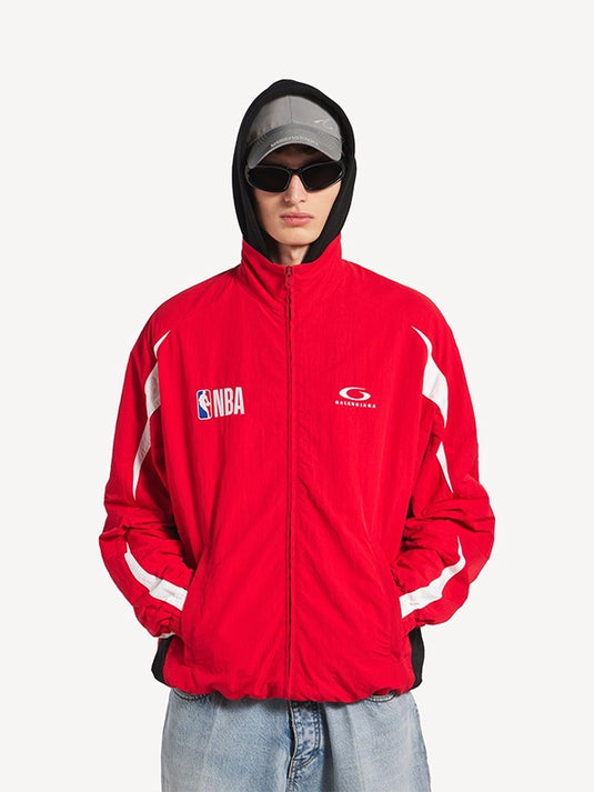 NBA x Balenciaga 2026 red track jacket with full zip design, oversized silhouette, and luxury streetwear attitude