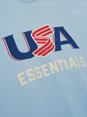 RECREATED Fear of God Essentials 2026 USA Baseball Blue Merch Tee crafted from soft cotton with a relaxed everyday fit