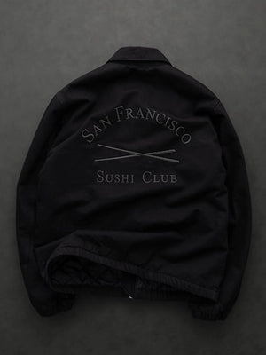 Black oversized denim jacket from Gap × Sushi Club featuring dropped shoulders and streetwear silhouette