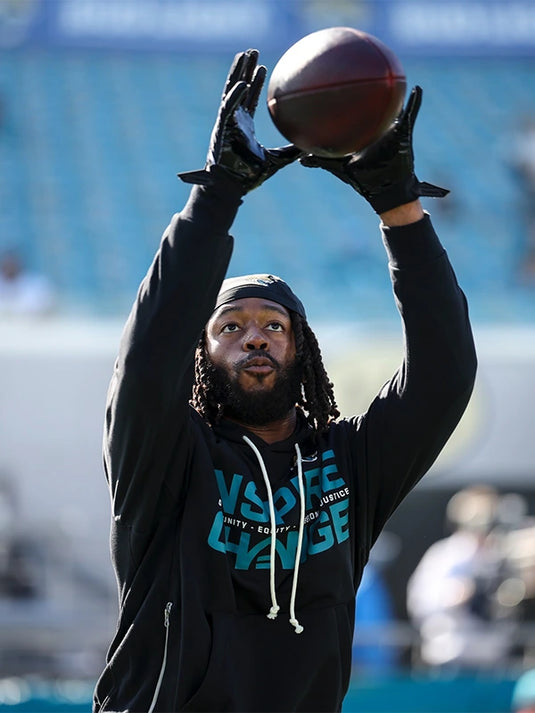 Nike black sideline hoodie for Jacksonville Jaguars 2025 featuring Opportunity Equity Freedom Justice lettering