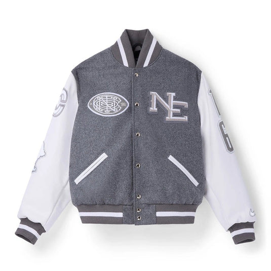 Grey and white Patriots 2025 Rivalries varsity jacket recreated with a wool body and clean Nike–CNCPTS design.