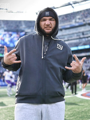Black Minnesota Vikings sideline bomber jacket recreation featuring Cam Skattebo and Nike design details