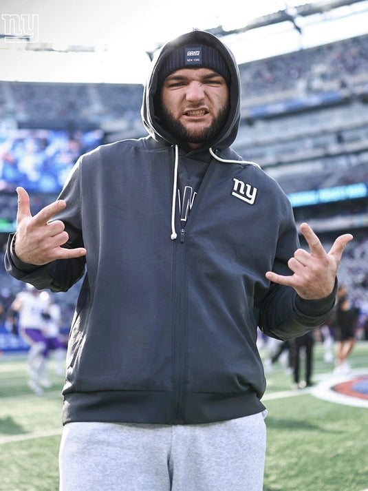 Black Minnesota Vikings sideline bomber jacket recreation featuring Cam Skattebo and Nike design details