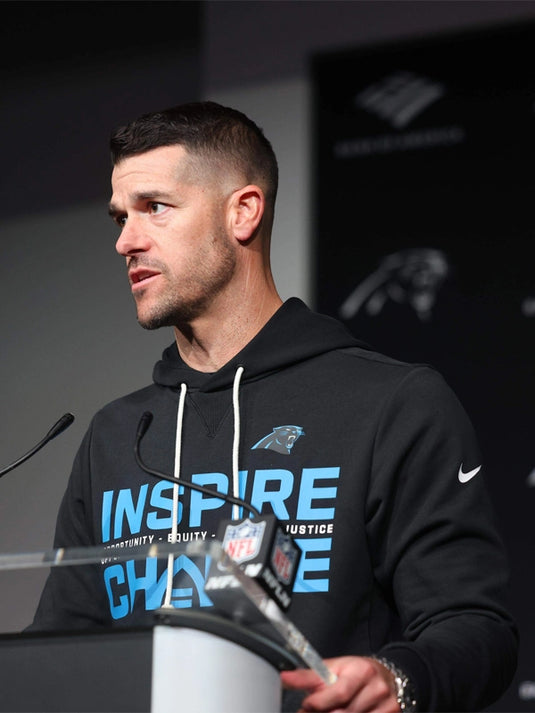 2025 Carolina Panthers Inspire Change black sideline pullover hoodie highlighting Opportunity Equity Freedom Justice text design
