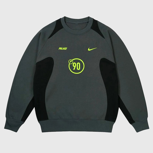 Palace x Nike 2025 Total P90 Crew Sweatshirt in charcoal grey fleece with clean branding and athletic edge.