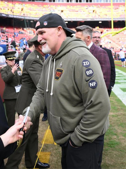 Washington Commanders 2025 Olive Green Salute to Service Hoodie inspired by Coach Dan Quinn’s sideline look.