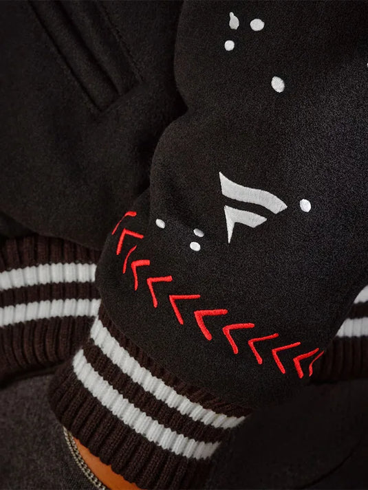 Los Angeles Dodgers 2025 Champions Varsity Jacket in black with Joshua Vides graphic artwork.