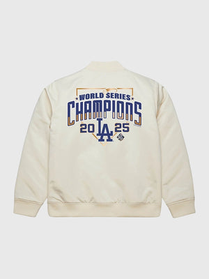 Los Angeles Dodgers 2025 Champions full-zip bomber jacket crafted by Mitchell & Ness in a soft cream tone.