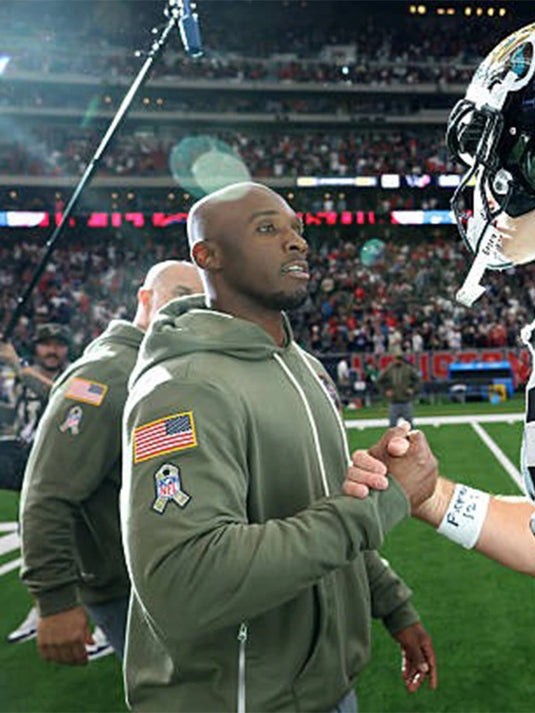 Houston Texans 2025 Salute to Service olive green hoodie inspired by Coach DeMeco Ryans’ sideline apparel.