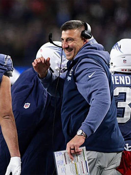 Patriots 2025 navy Rivalries Unisex Pullover Hoodie with a sleek full-zip design modeled after Coach Mike Vrabel.