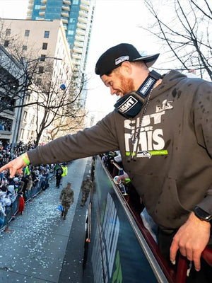 Recreated grey Seattle Seahawks Champions parade fleece hoodie featuring Sam Darnold tribute and team branding