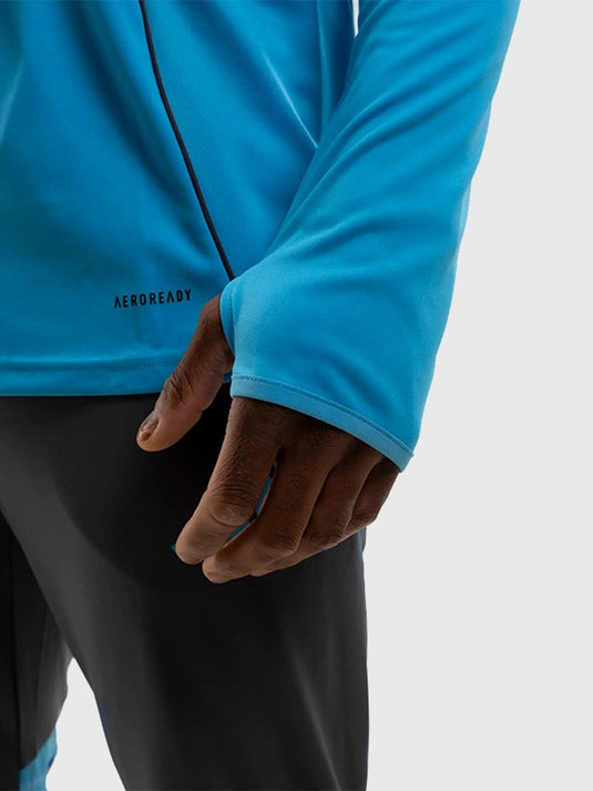 Adidas 2025/26 Newcastle United Players Range blue 1/4 zip T-shirt designed for mobility and clean minimal style.