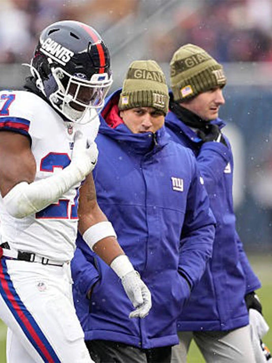 Blue New York Giants 2025 puffer jacket with hood, designed for warmth and modern athletic comfort.