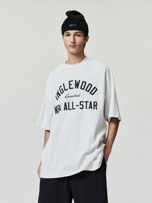 Recreated grey All Star Weekend ’26 90s tee by Essentials Inglewood with classic crew neck and graphic front