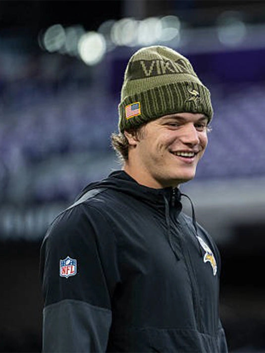 Sleek black half-zip anorak hoodie from Nike’s Minnesota Vikings Sideline Collection worn by J.J. McCarthy.