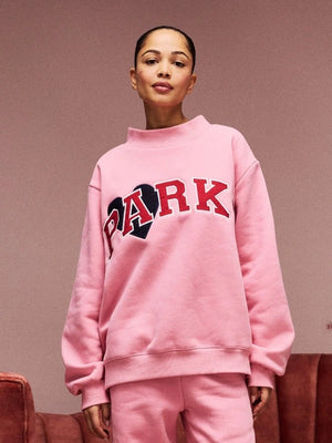 RECREATED Women’s Valentine’s 2026 Parke Jean Heart varsity mockneck fleece sweatshirt in pink with soft brushed fabric