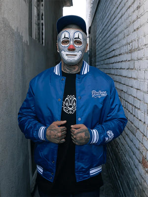 Recreation Dodgers x Mister Cartoon collaboration jacket in blue satin showcasing street-art influence and vintage flair.