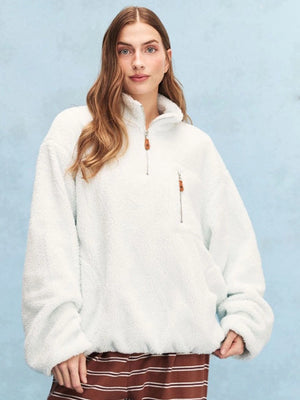 Light blue Parke 2026 quarter zip sweatshirt crafted in soft fleece, featuring a relaxed fit and minimalist design