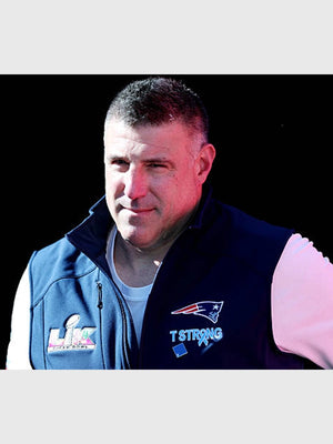 Navy fleece vest with full zipper and T Strong branding modeled after Mike Vrabel’s Super Bowl LX Patriots sideline gear
