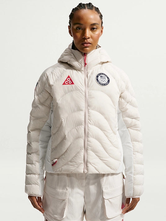Recreated Winter Olympic 2026 Team USA white puffer jacket featuring Nike ACG and Therma-FIT ADV tech for warmth and weather resistance
