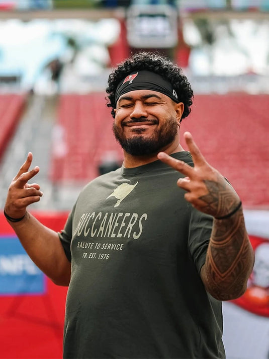 Nike olive green Tampa Bay Buccaneers 2025 Salute to Service sideline T-shirt with moisture-wicking fabric.