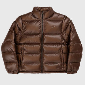 Recreated Nocta x Nike brown puffer down jacket showcasing signature Sunset styling and premium insulation.