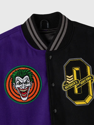 RECREATED October’s Very Own 2026 Split Varsity Jacket in Black & Purple inspired by Batman and The Joker with a structured athletic design