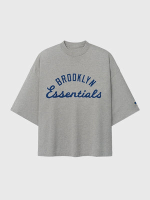 Essentials Fear of God Jackie Robinson Day Grey Oversized T-Shirt showcasing subtle graphic detailing and modern streetwear appeal