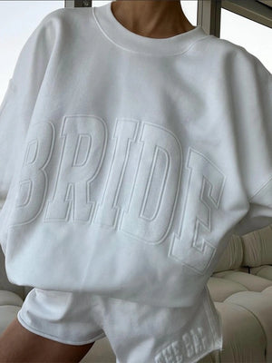 RECREATED The Bar 2026 Bride White Pullover Oversized Sweatshirt featuring a soft interior fleece feel and modern casual appeal