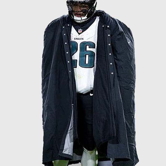 Jalen Hurts black cape coat from the 2025 Philadelphia Eagles sideline collection combining style and functional comfort.