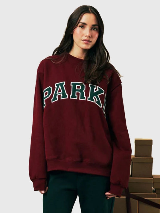 Recreated 2025 Parke Holiday maroon fleece mockneck sweatshirt offering a cozy fit and subtle collegiate-style elements.