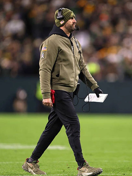 2025 Philadelphia Eagles Salute to Service cotton bomber jacket in olive green with coach-inspired details.