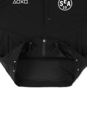 Recreated crossover tech jacket in black reflecting PlayStation branding and Wind and Sea streetwear influence