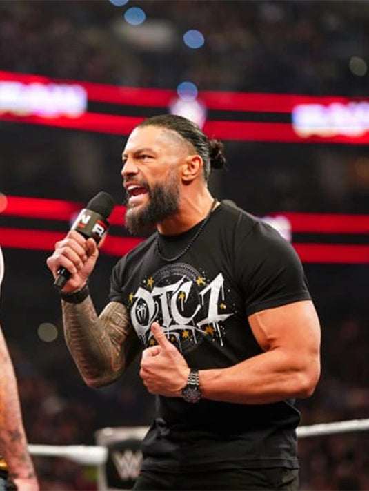 Recreated WWE RAW 2026 Roman Reigns t-shirt in black with a bold OTC-1 gold graphic and classic crewneck construction.