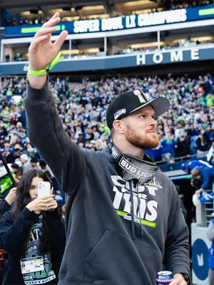Recreated Super Bowl LX Champions Parade Sam Darnold Seattle Seahawks grey pullover hoodie with bold championship graphics