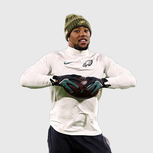 Nike off-white long sleeve T-shirt showcasing Eagles vs Packers game design with Saquon Barkley imagery.