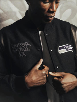 Recreation Super Bowl LX Seahawks champions varsity jacket in black featuring team logos and classic snap-front closure