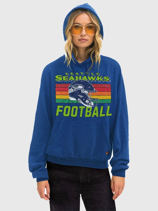 Blue RECREATED Aviator Nation Seattle Seahawks 2026 relaxed fleece hoodie featuring bold helmet graphic and unisex fit
