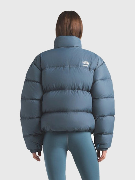 Recreated 2025 drop blue Nuptse puffer jacket by The North Face × SKIMS with structured silhouette and winter-ready insulation.