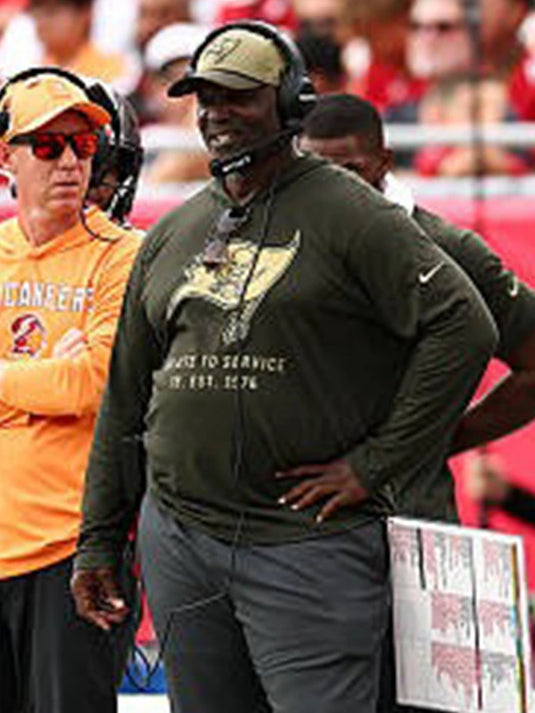 2025 Tampa Bay Buccaneers Salute to Service hooded shirt inspired by Coach Todd Bowles’ sideline style.