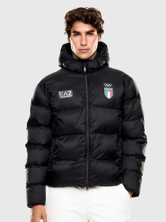 Milano Cortina 2026 themed black hooded parachute puffer jacket by EA7 Emporio Armani featuring lightweight warmth and functional silhouette