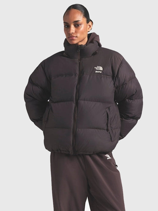 Brown Nuptse puffer jacket recreated from The North Face × SKIMS 2025 drop featuring padded panels and boxy silhouette.